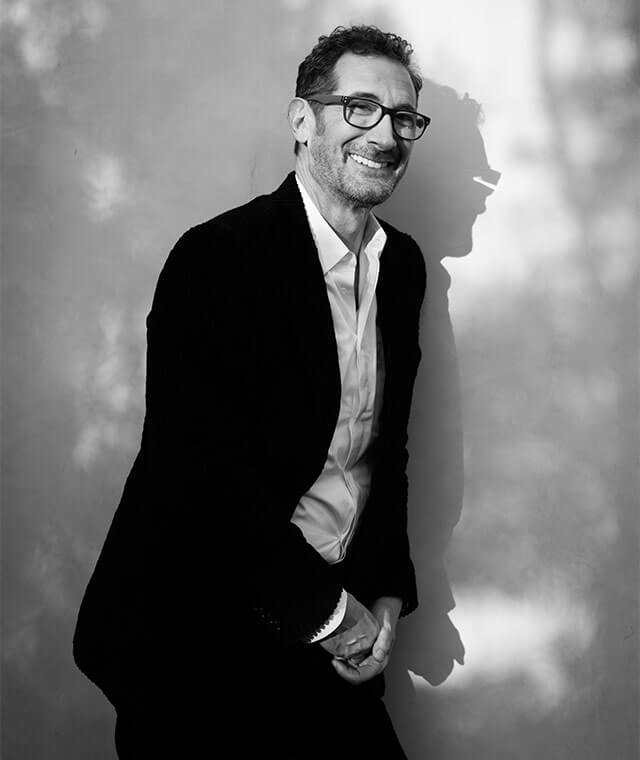 Dr. Jonathan Sykes wearing a suit black and white image